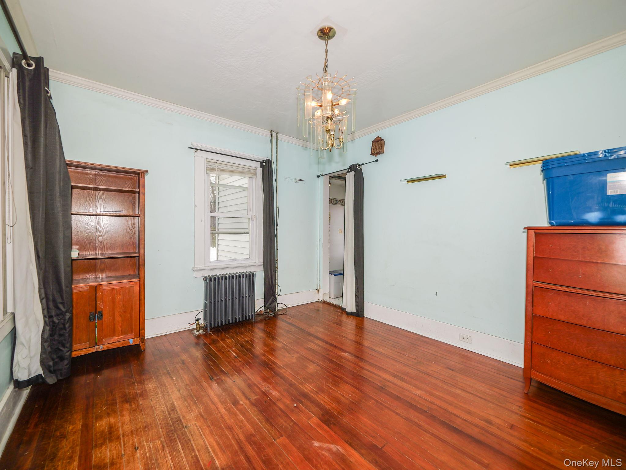 809 South Street Newburgh, NY 12550 - Photo 6 of 45 a view of an empty room with a window and wooden floor