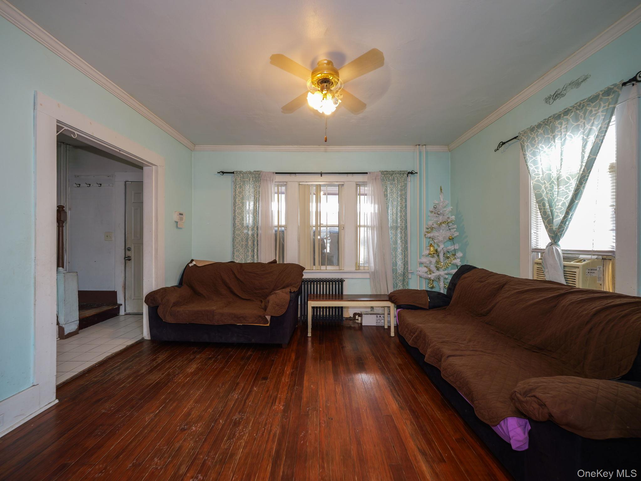 809 South Street Newburgh, NY 12550 - Photo 10 of 45 a living room with furniture and a wooden floor
