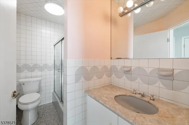 a view of a hallway with washer and dryer