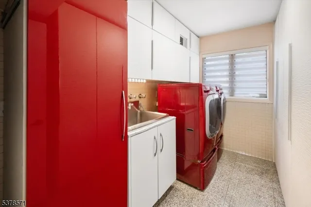 a living room with a bed furniture and a fireplace