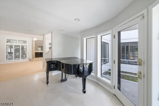 a view of a livingroom with furniture and a window