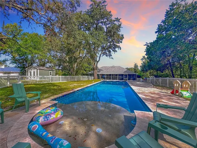 a view of a backyard with sitting area