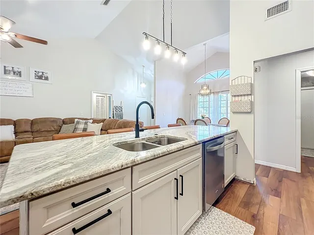 a bedroom with furniture and a large window