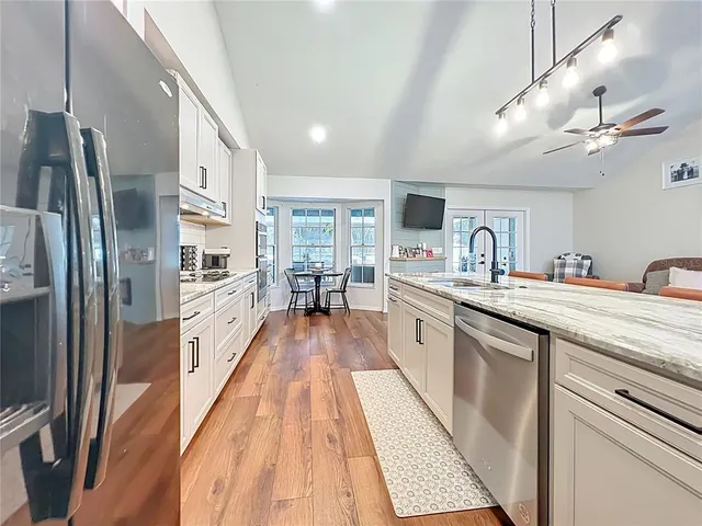 a bedroom with furniture and a window