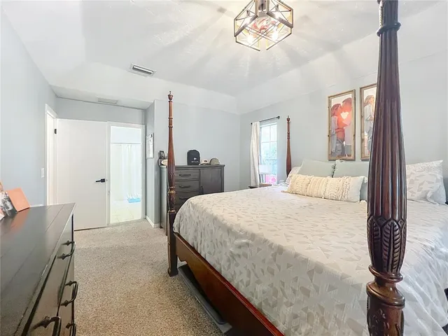 a view of hallway with washer and dryer next to a window