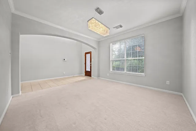 a kitchen with granite countertop cabinets stainless steel appliances a sink and a window