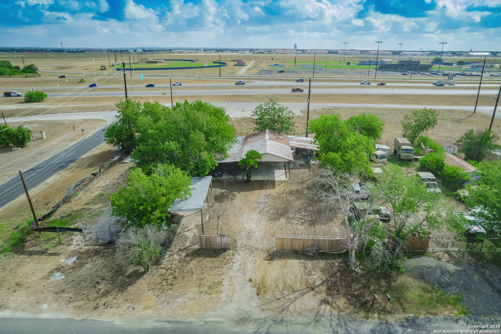 an aerial view of a yard with outdoor seating