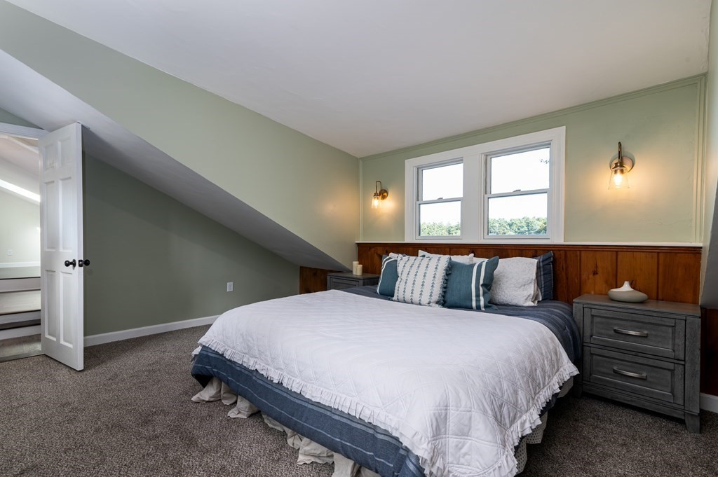 46 Oak Place Halifax, MA 02338 - Photo 18 of 42 a bed sitting in a bedroom next to a window