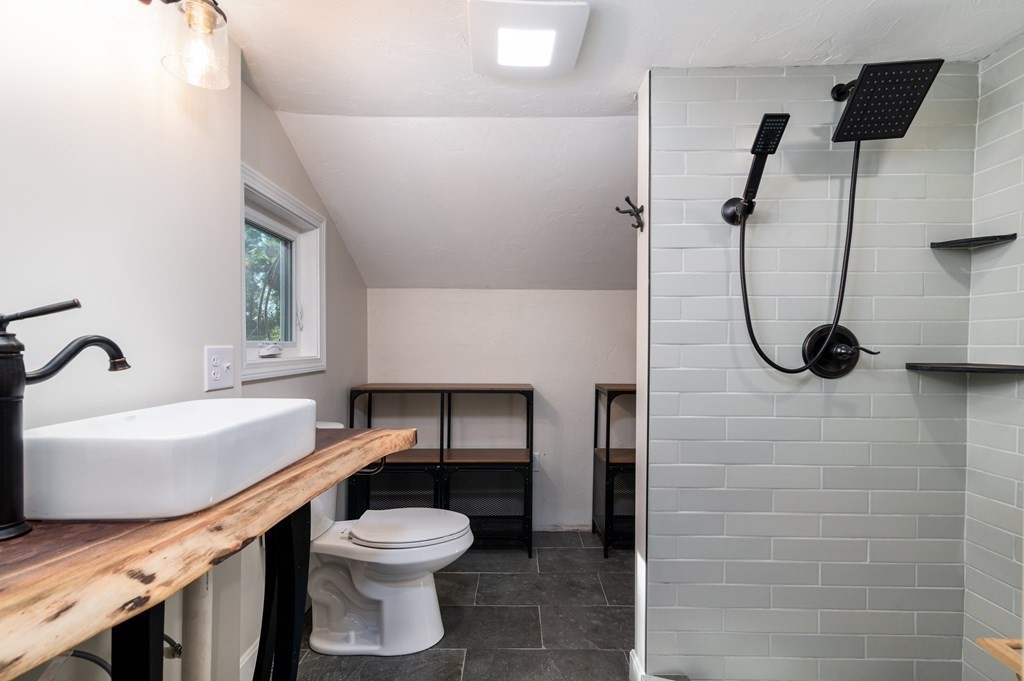 46 Oak Place Halifax, MA 02338 - Photo 19 of 42 a bathroom with a sink a toilet and a shower