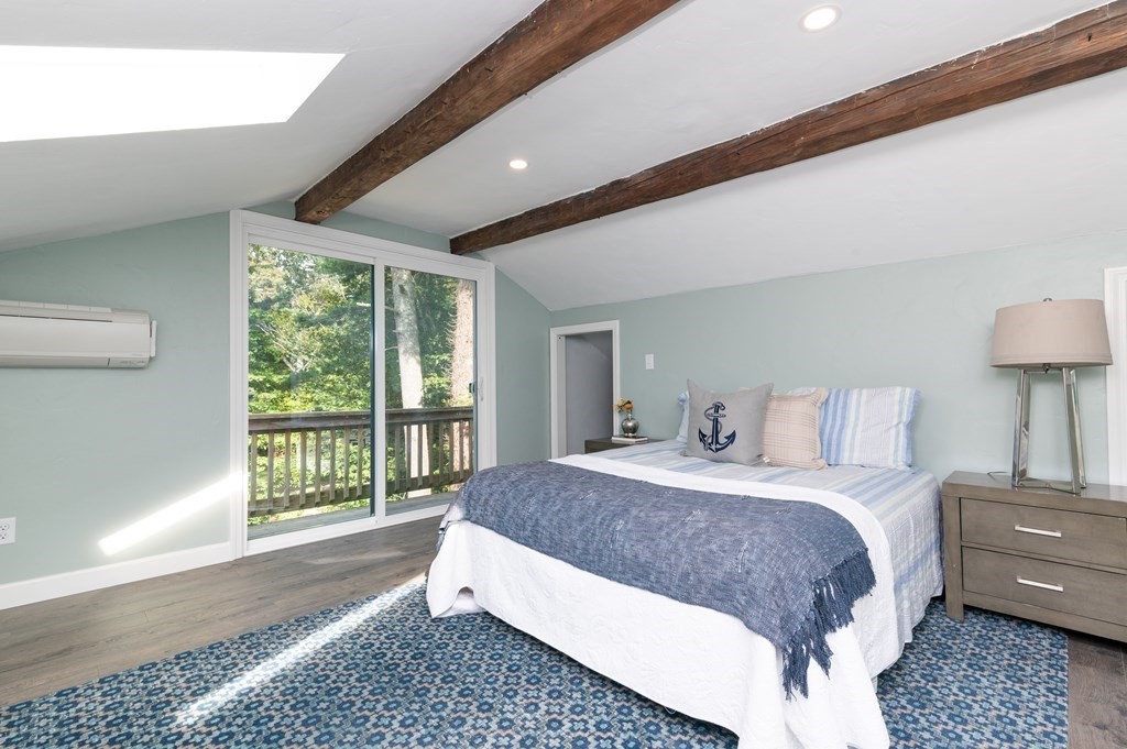 46 Oak Place Halifax, MA 02338 - Photo 21 of 42 a spacious bedroom with a large bed and a window