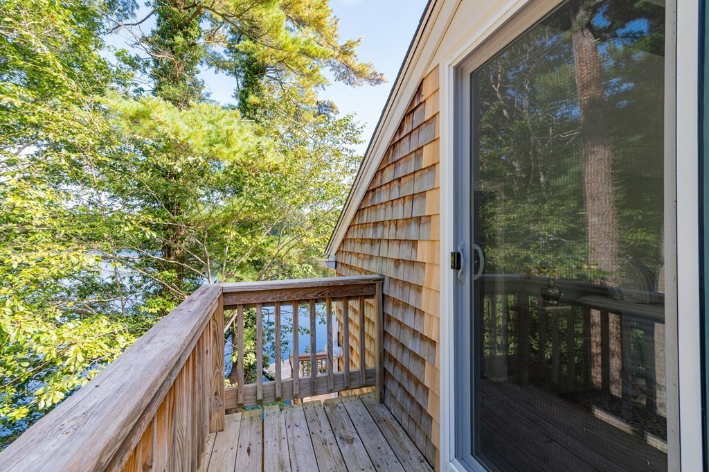 46 Oak Place Halifax, MA 02338 - Photo 22 of 42 a balcony with wooden floor in front of it