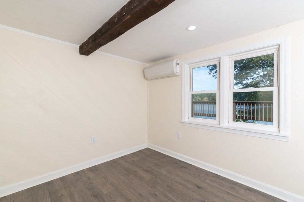46 Oak Place Halifax, MA 02338 - Photo 26 of 42 an empty room with wooden floor and windows