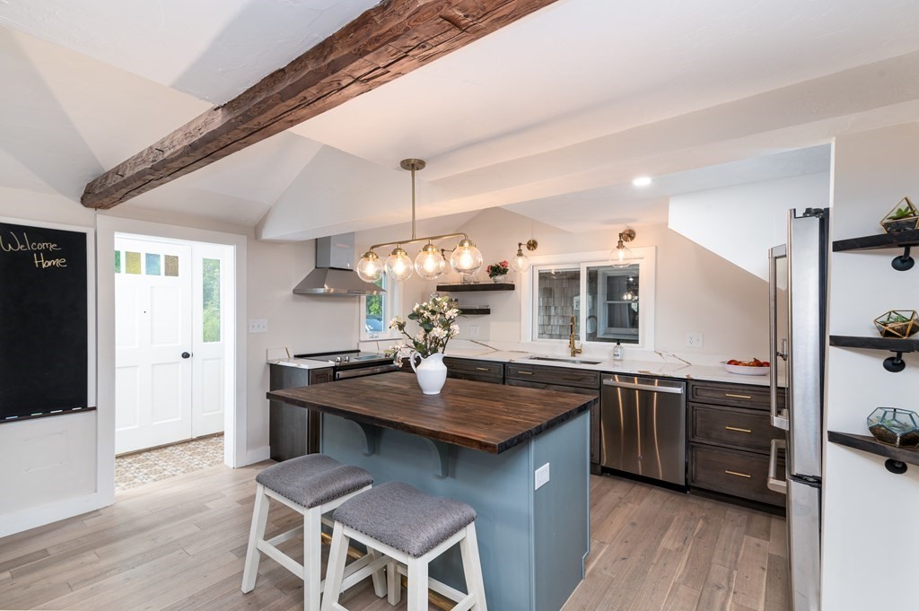 46 Oak Place Halifax, MA 02338 - Photo 8 of 42 a kitchen with a sink cabinets and wooden floor