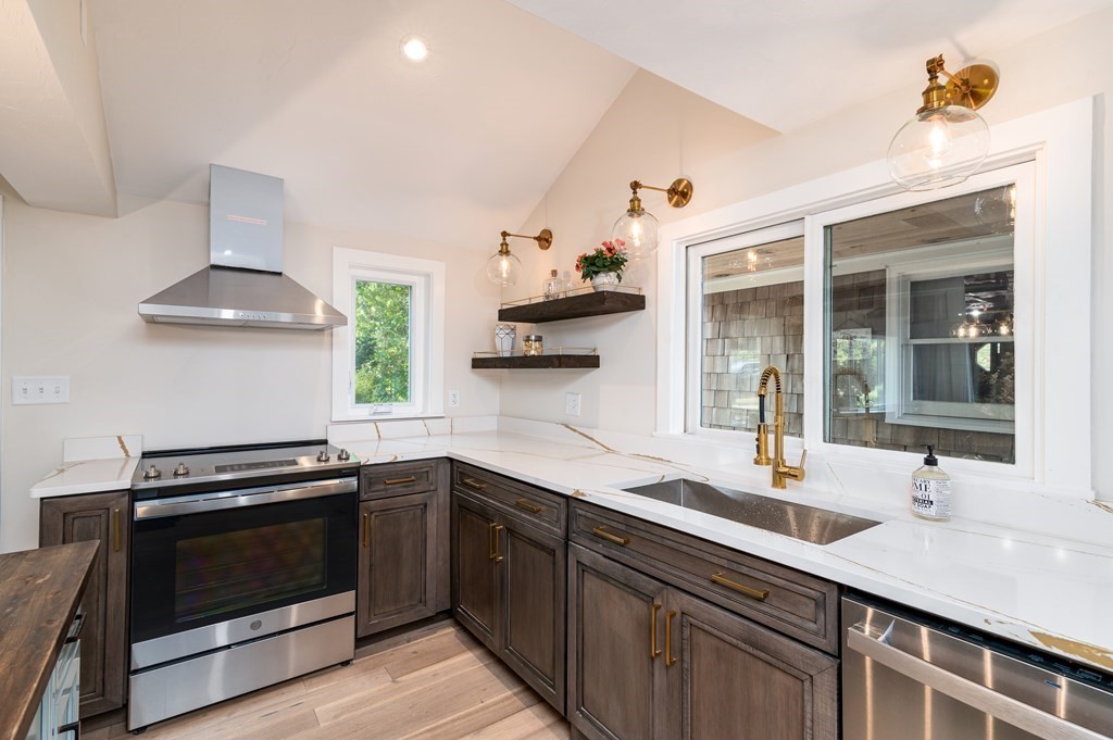 46 Oak Place Halifax, MA 02338 - Photo 9 of 42 a kitchen with a sink and stove