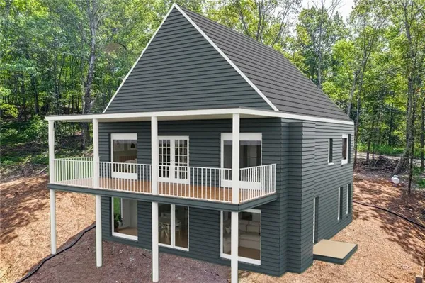 a view of a lush green forest with lots of trees