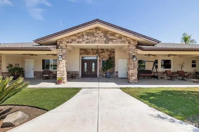 a bathroom with a toilet a sink and a mirror