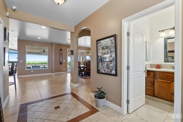 a living room with furniture large window and a flat screen tv