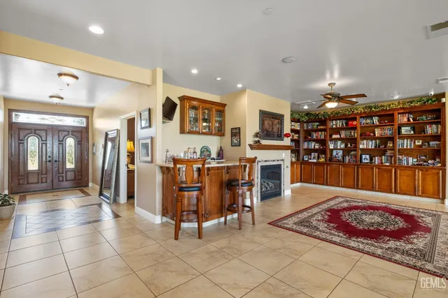 a living room with fireplace furniture and a flat screen tv