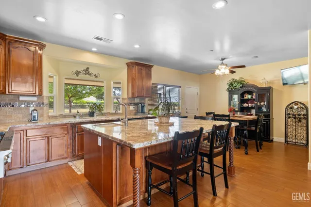 a living room with furniture rug and a large window
