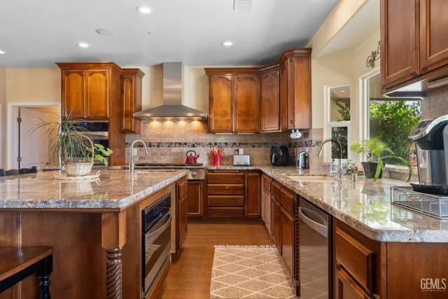 a bed room with a bed flat screen tv and a window