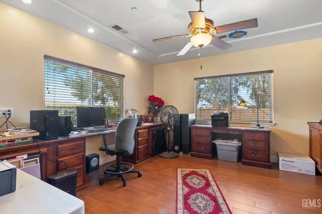 a bedroom with furniture and a flat screen tv