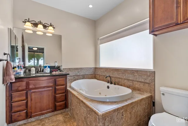 a view of a house with backyard and trees