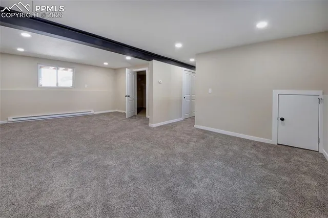 an empty room with a ceiling fan