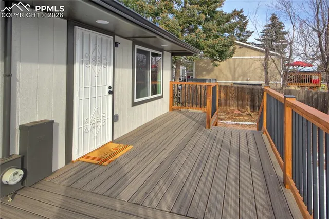 a view of a house with a yard covered in snow