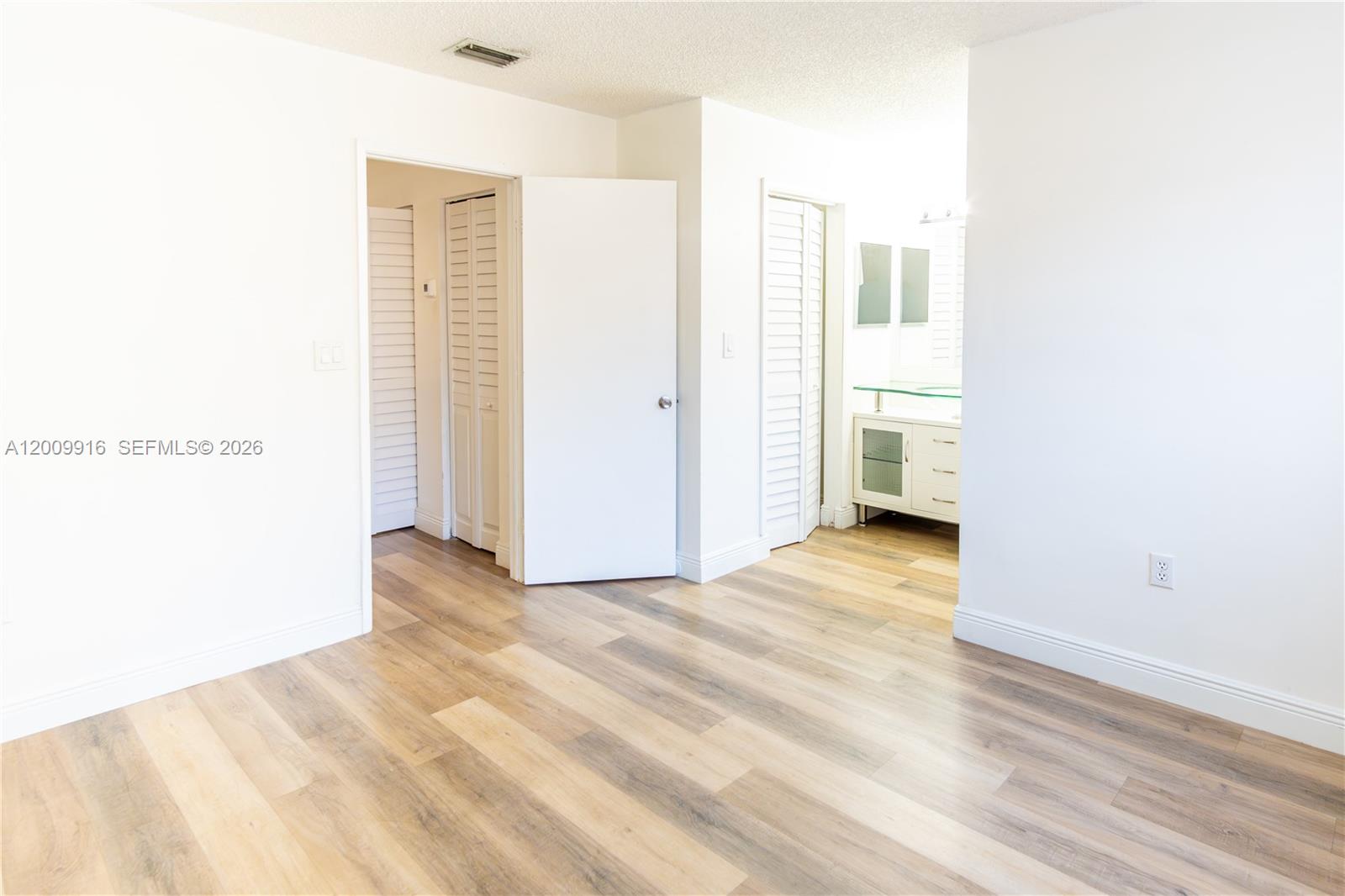 14905 Southwest 80th Street, Unit 212 Miami, FL 33193 - Photo 15 of 37 a view of a room with wooden floor