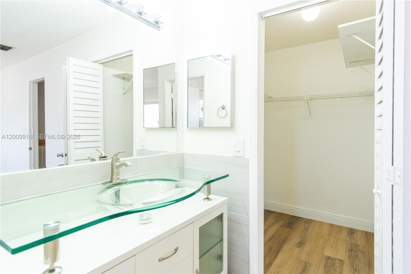 14905 Southwest 80th Street, Unit 212 Miami, FL 33193 - Photo 23 of 37 a bathroom with a sink and a bathtub