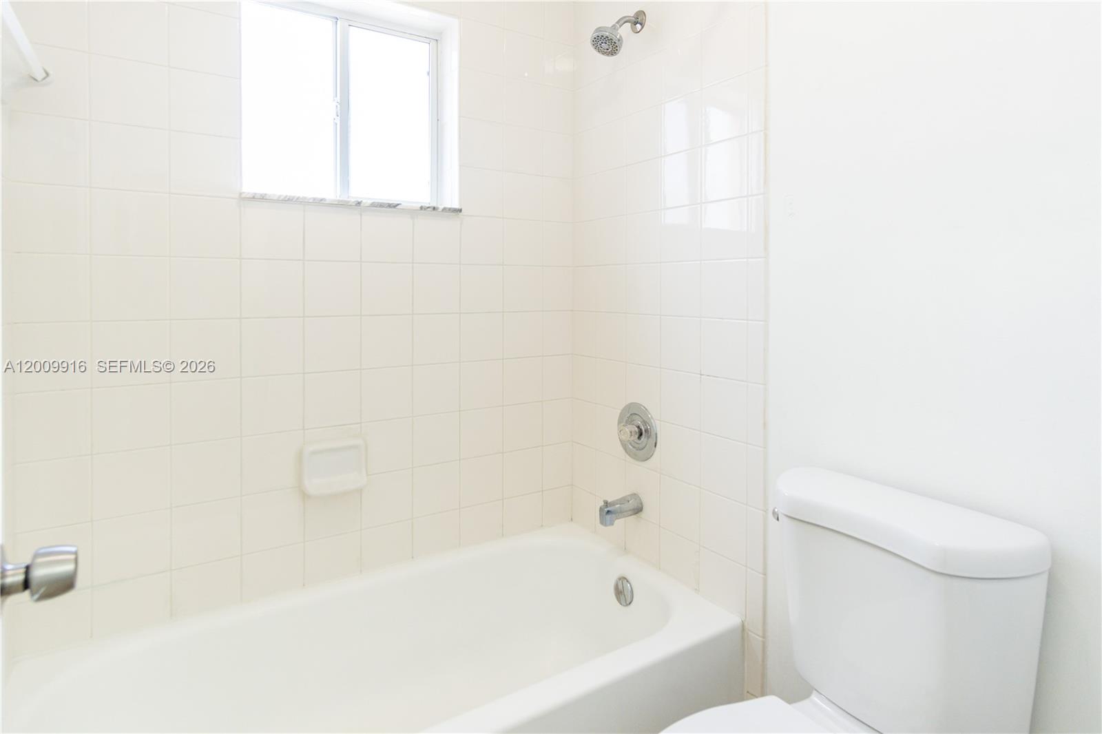 14905 Southwest 80th Street, Unit 212 Miami, FL 33193 - Photo 25 of 37 a bathroom with a bathtub and a toilet