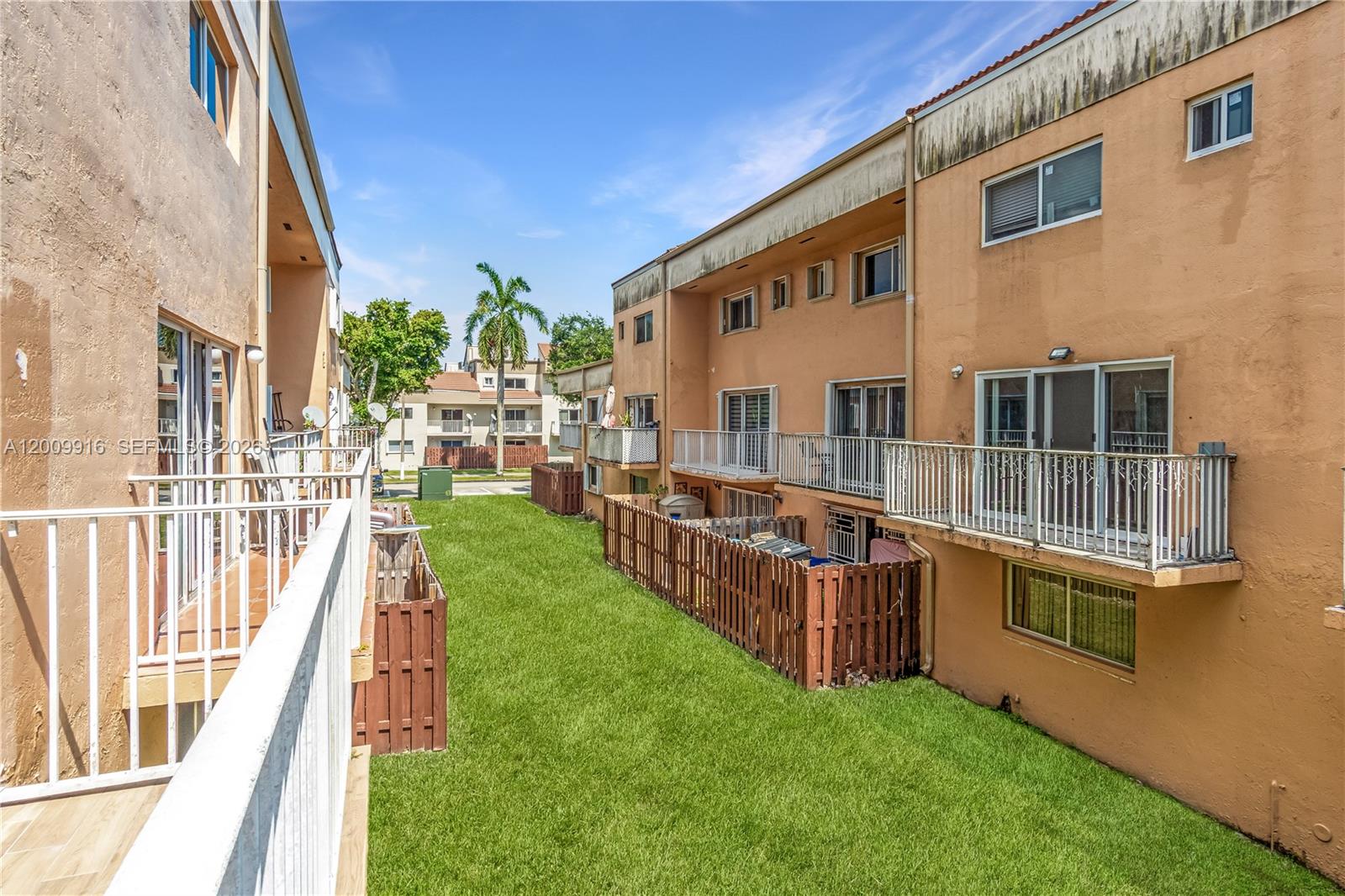 14905 Southwest 80th Street, Unit 212 Miami, FL 33193 - Photo 33 of 37 a view of an house with backyard and kitchen
