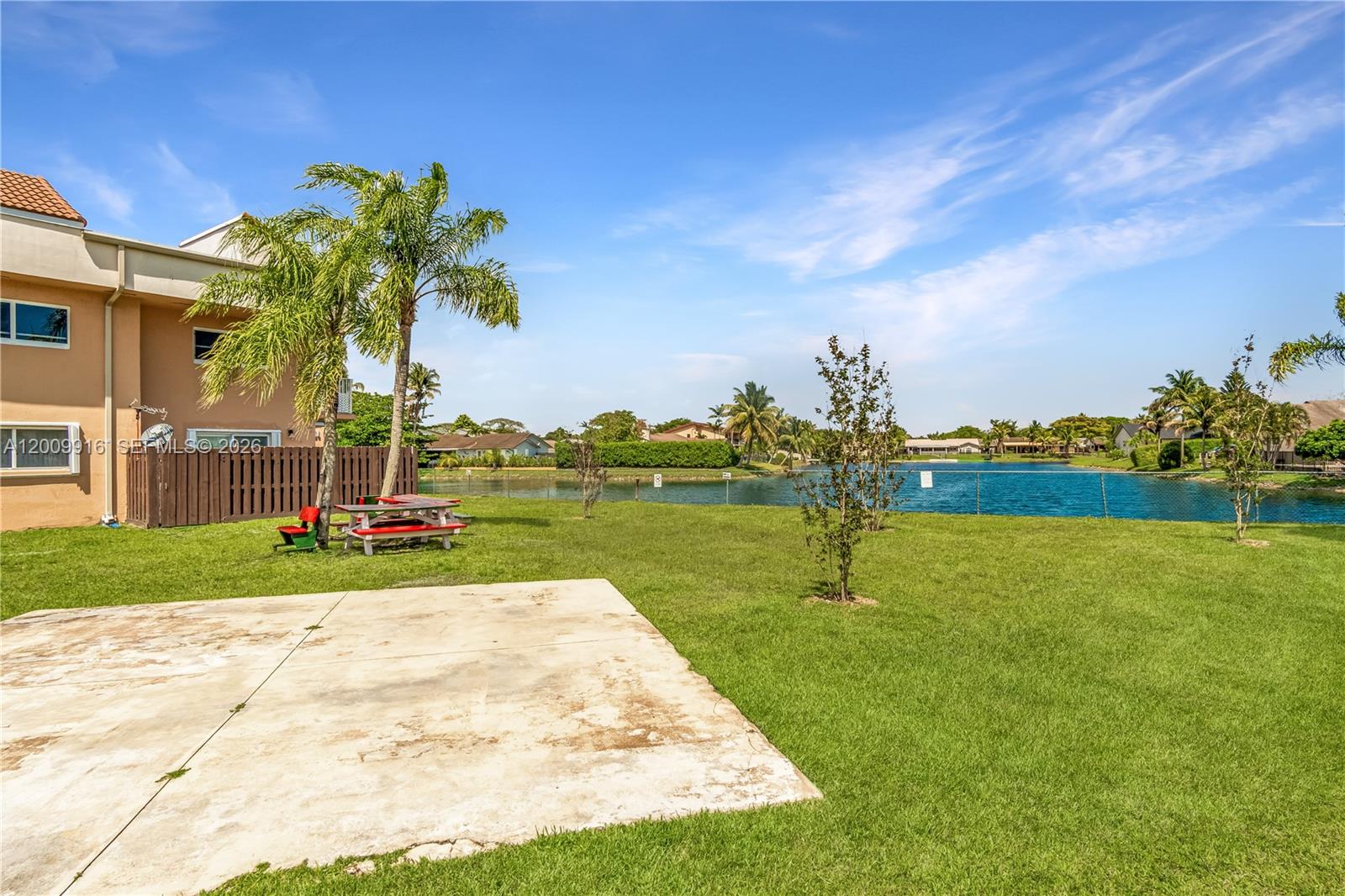14905 Southwest 80th Street, Unit 212 Miami, FL 33193 - Photo 7 of 37 a park view with a bench and trees