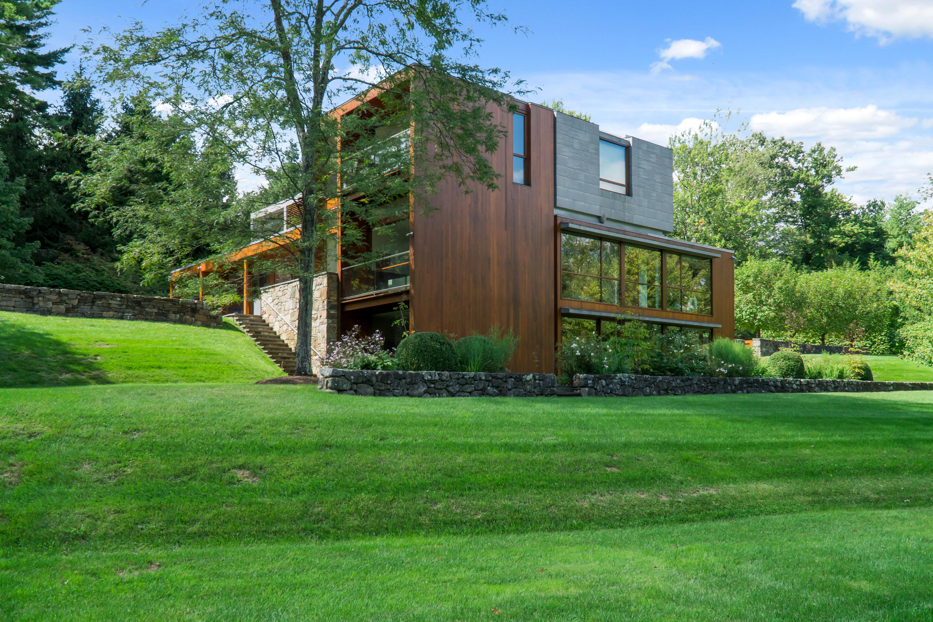 81 Cross Ridge Road New Canaan, CT 06840 - Photo 1 of 49 a view of a back yard of the house
