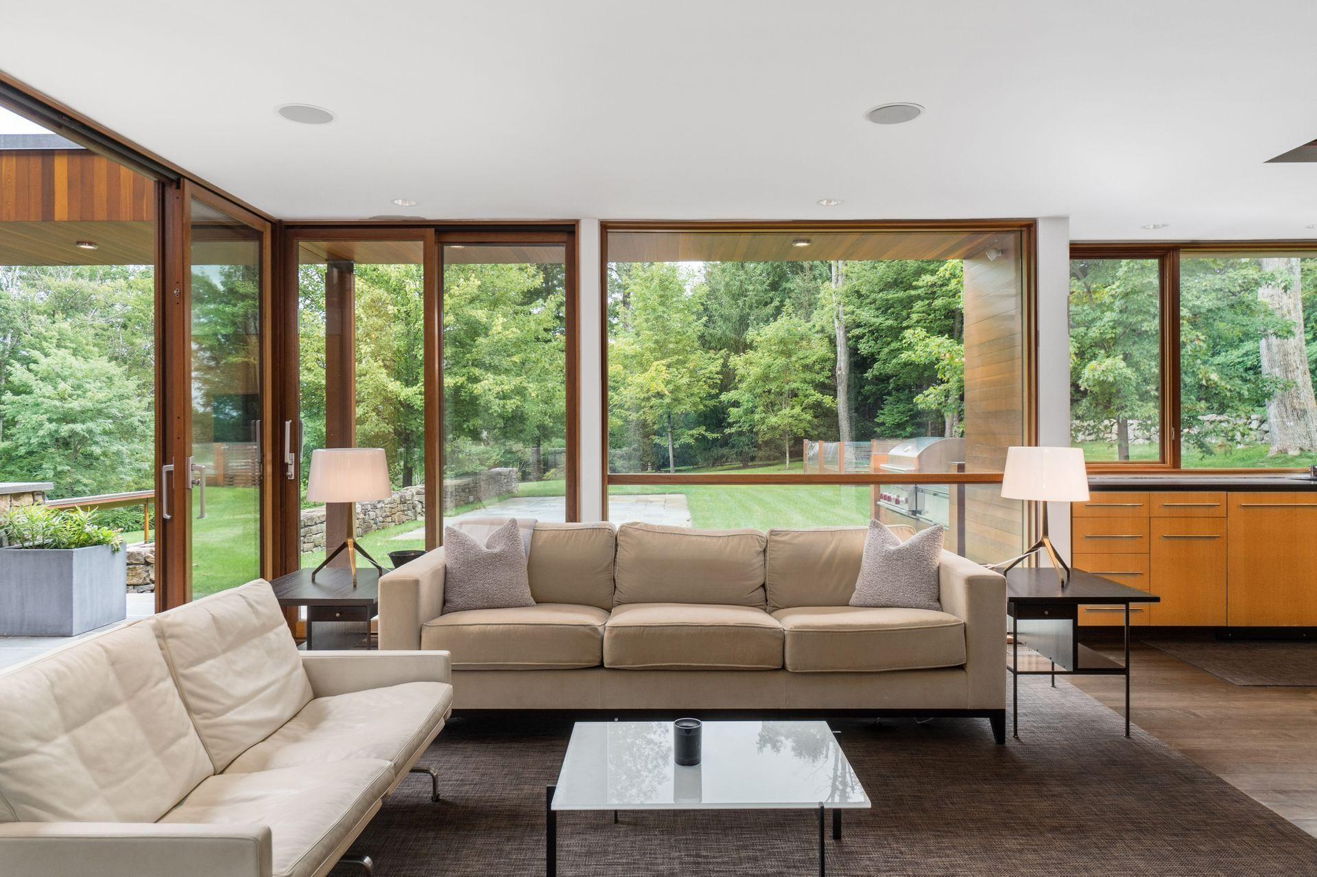 81 Cross Ridge Road New Canaan, CT 06840 - Photo 11 of 49 a living room with furniture and a large window