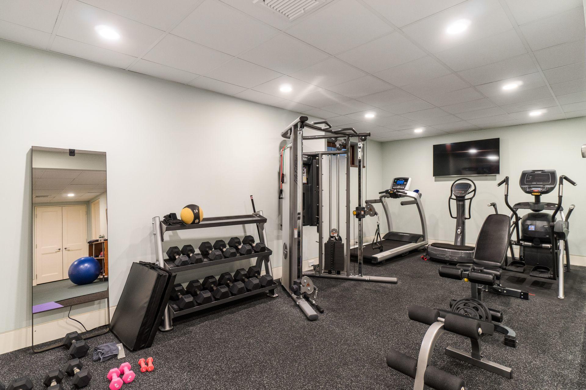 81 Cross Ridge Road New Canaan, CT 06840 - Photo 27 of 49 a view of a room with gym equipment