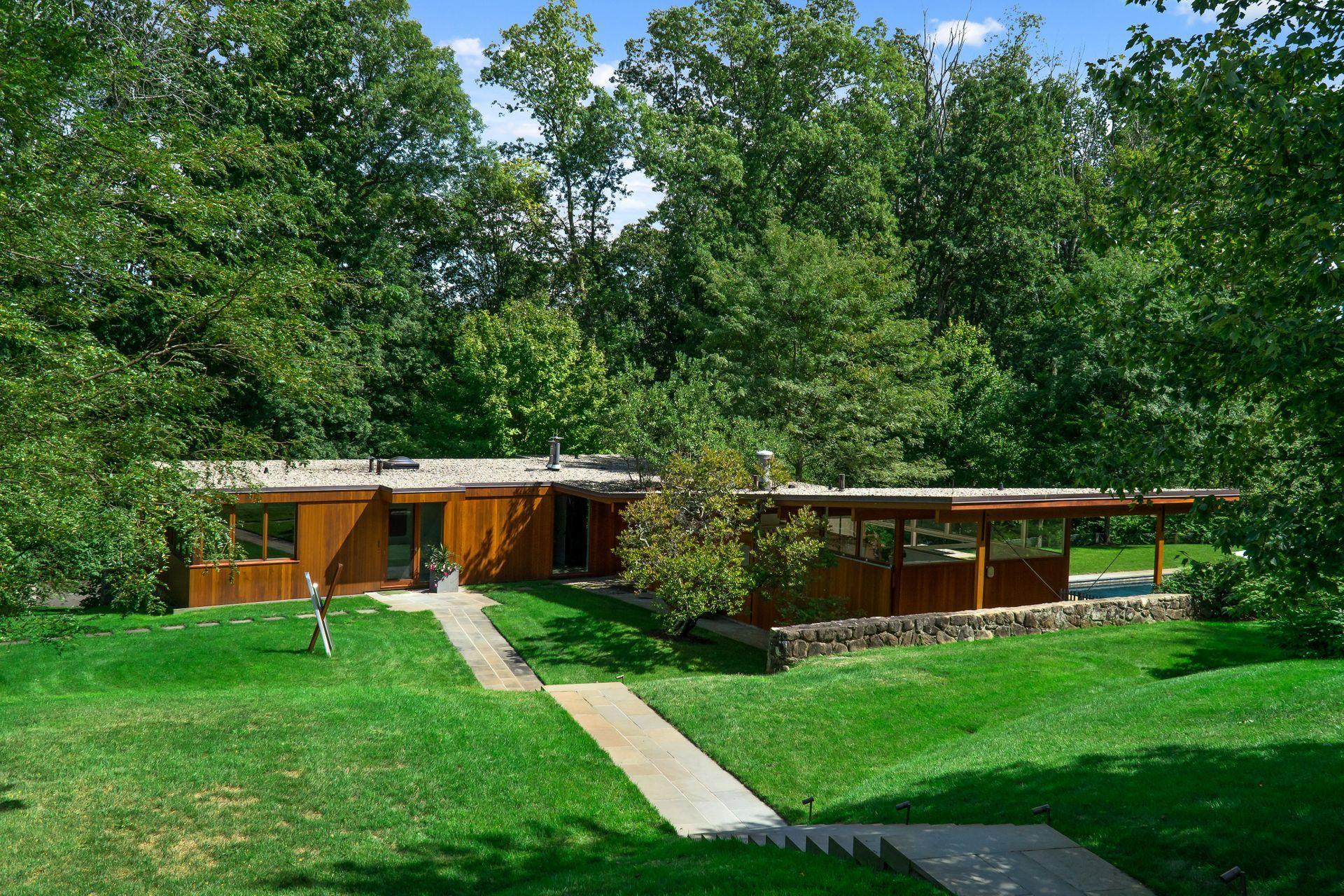 81 Cross Ridge Road New Canaan, CT 06840 - Photo 28 of 49 a view of house with backyard space and garden