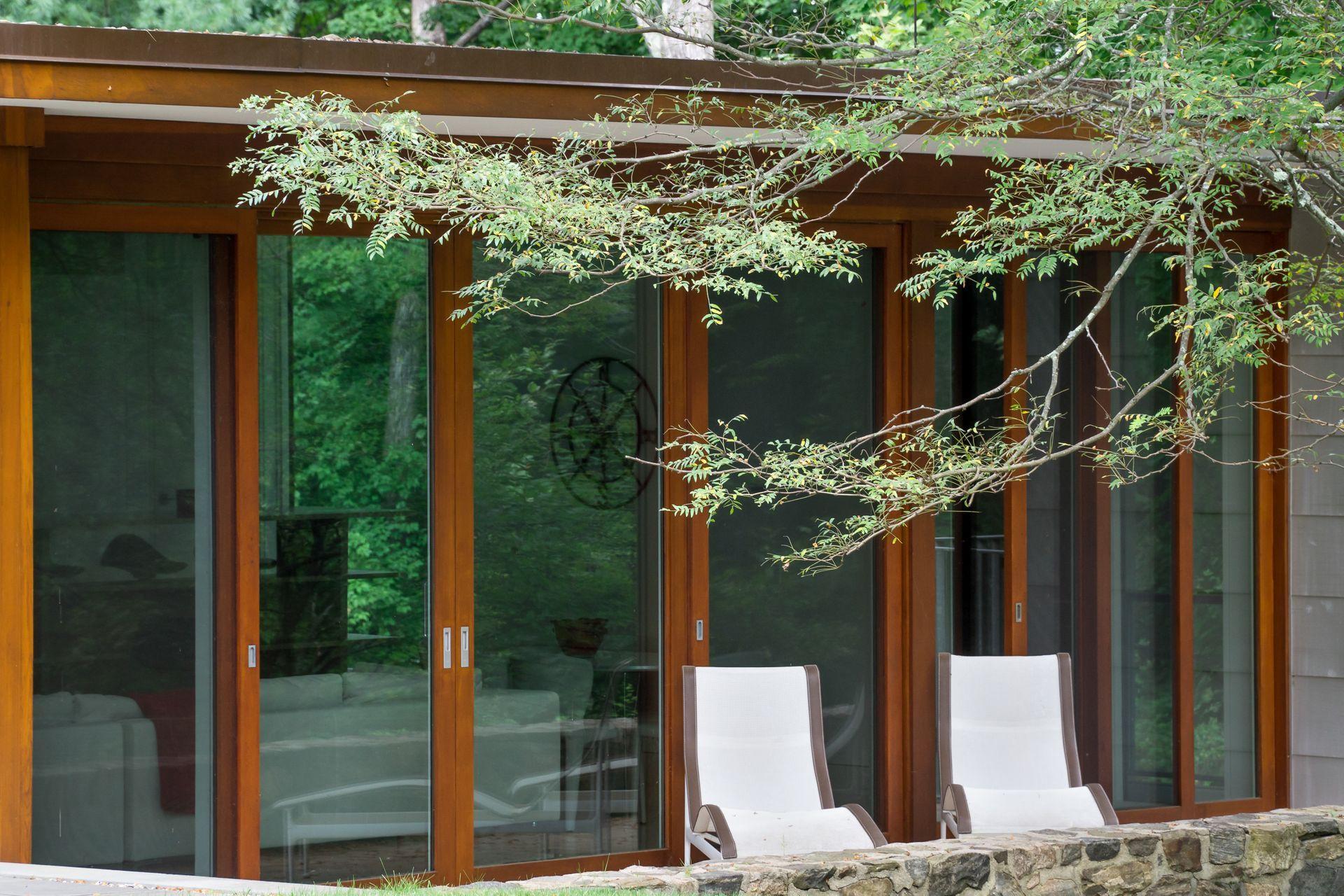 81 Cross Ridge Road New Canaan, CT 06840 - Photo 36 of 49 a view of a house with a tree