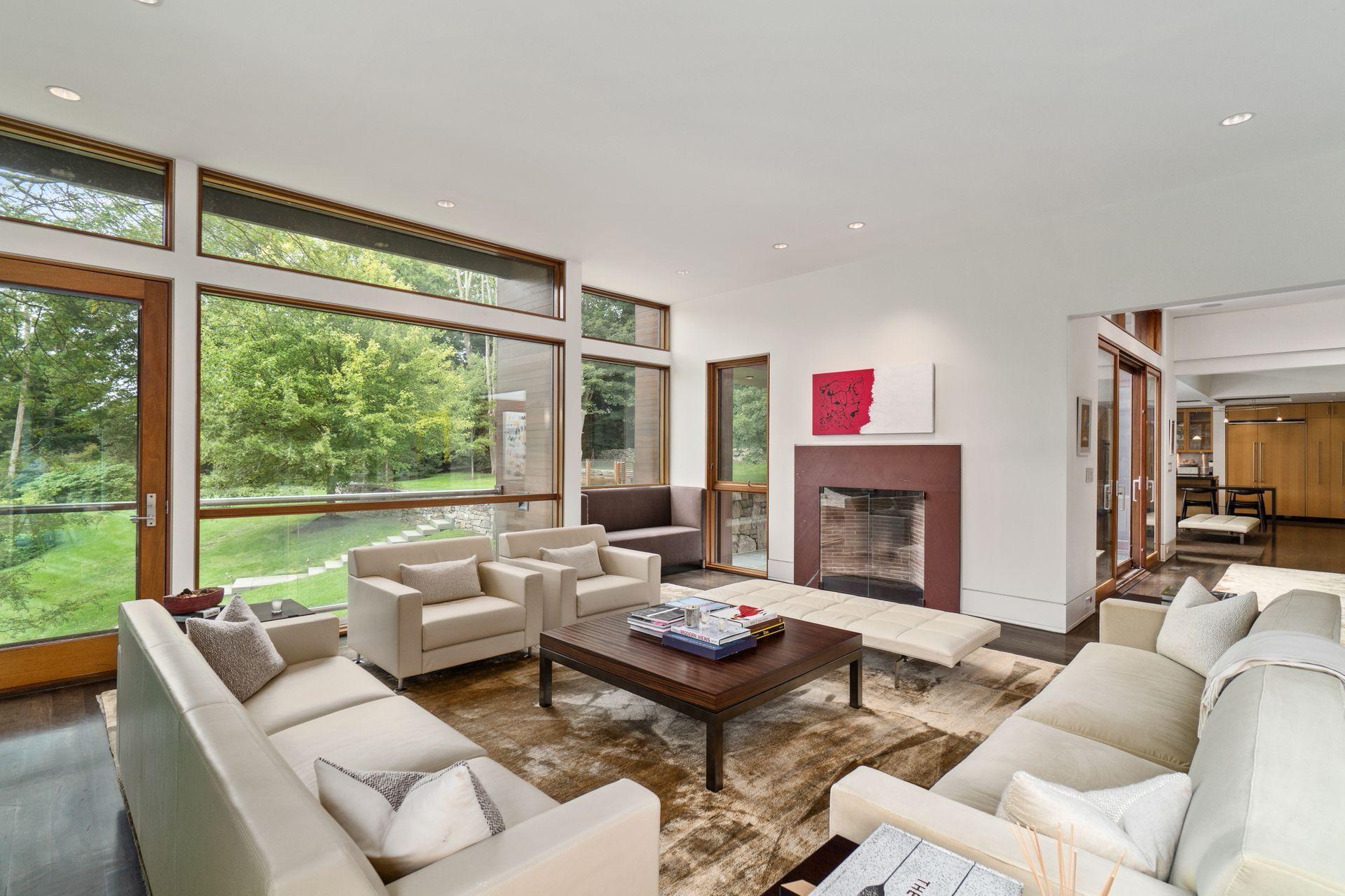 81 Cross Ridge Road New Canaan, CT 06840 - Photo 8 of 49 a living room with furniture and a large window