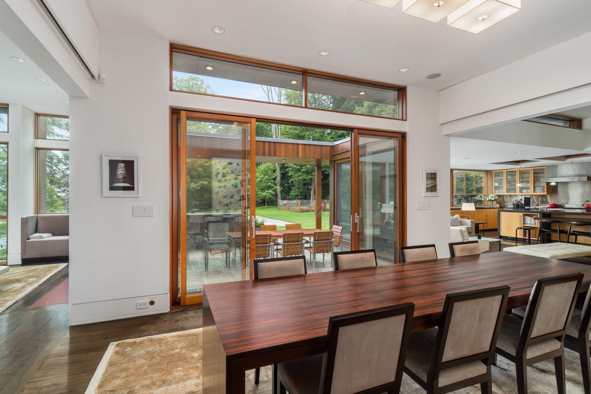 81 Cross Ridge Road New Canaan, CT 06840 - Photo 9 of 49 a dining room with furniture window and wooden floor