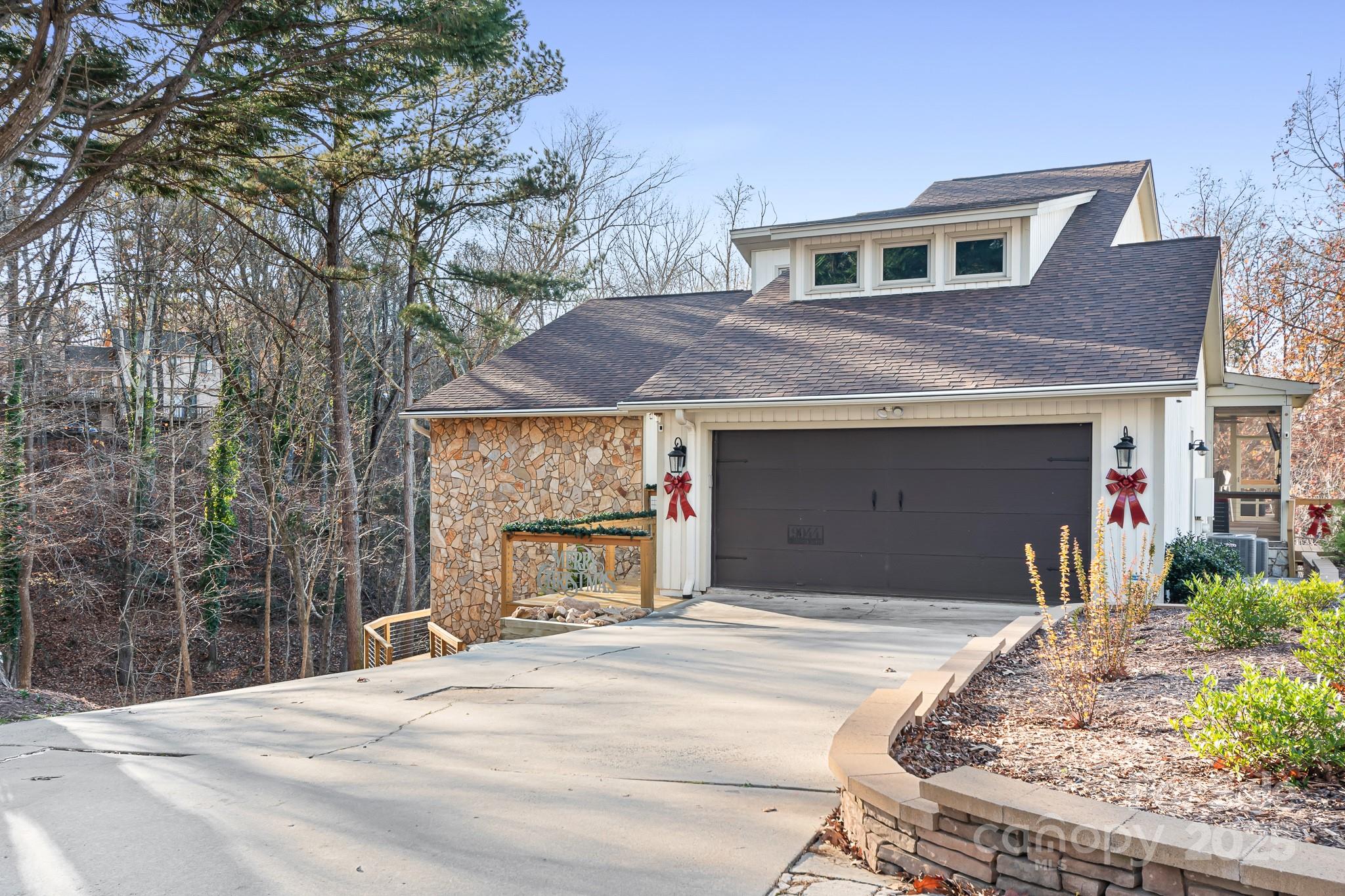 9044 Spanish Wells Court Tega Cay, SC 29708 - Photo 1 of 48 a front view of a house with a yard and garage