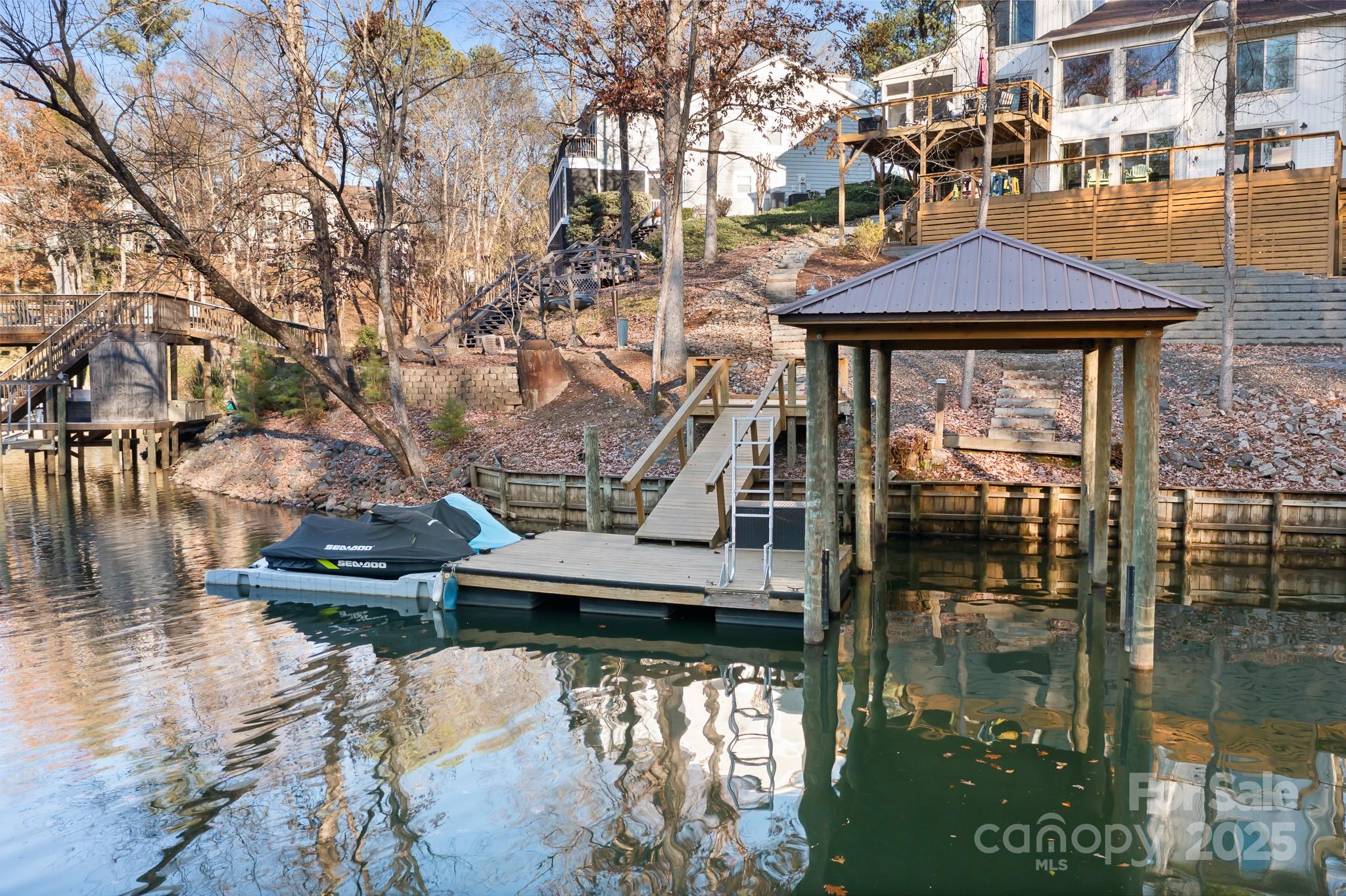 9044 Spanish Wells Court Tega Cay, SC 29708 - Photo 45 of 48 a front view of a house with lake view