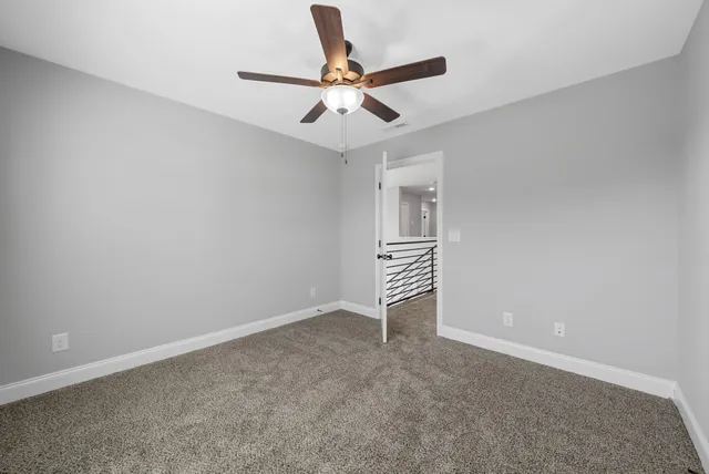 a view of room with ceiling fan