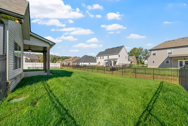 a view of a house with a big yard