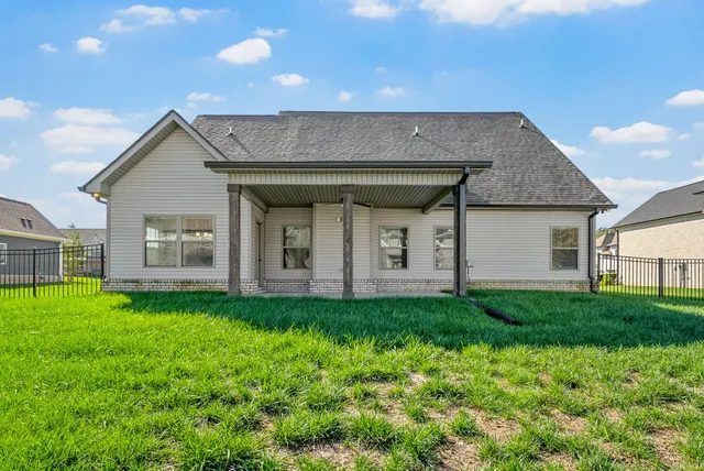 a view of multiple houses with a yard