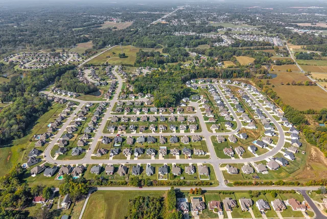 a view of house with outdoor space and sitting area