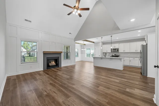 a view of kitchen and kitchen with sink hardwood floor