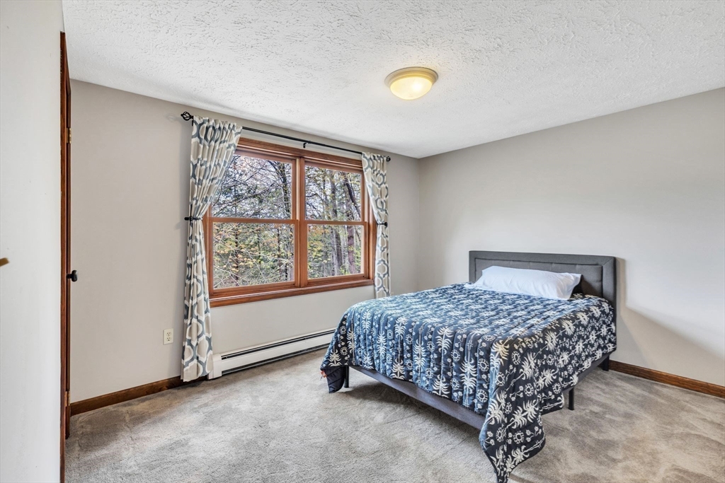 583 Main Road Chesterfield, MA 01012 - Photo 12 of 21 a bedroom with a bed and a window