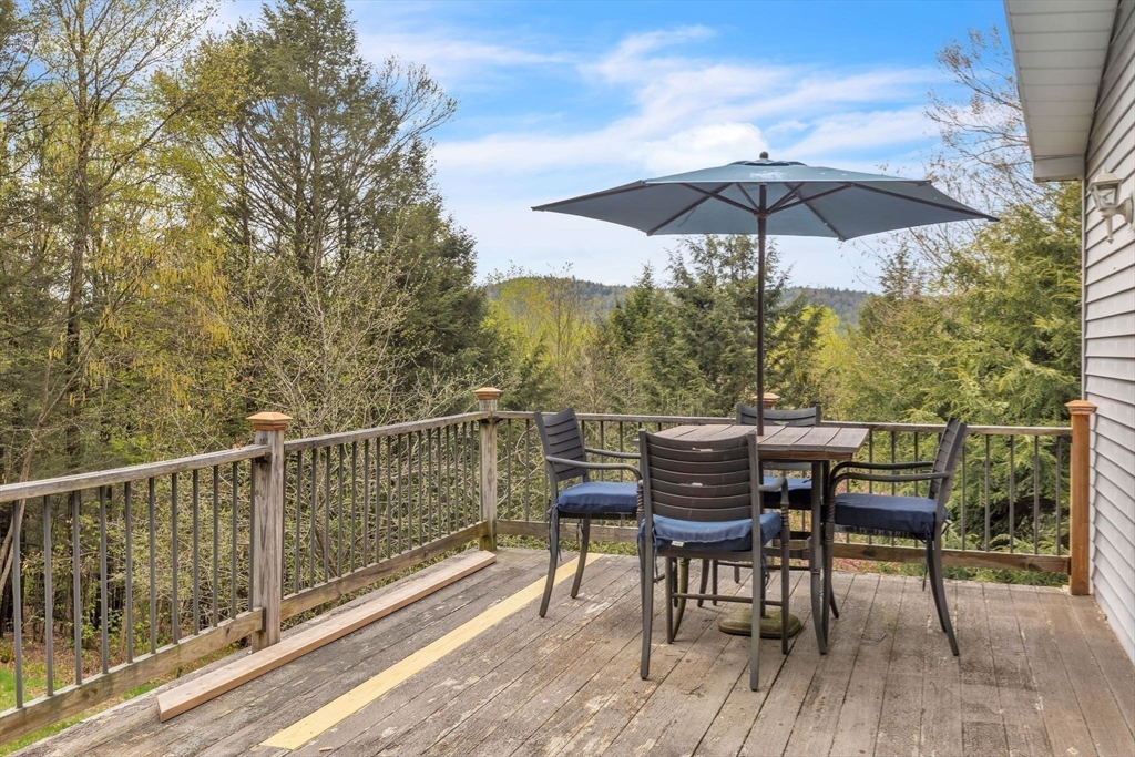 583 Main Road Chesterfield, MA 01012 - Photo 15 of 21 a view of a deck with furniture
