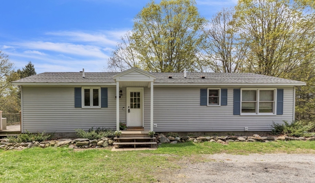 583 Main Road Chesterfield, MA 01012 - Photo 17 of 21 a front view of a house with a garden